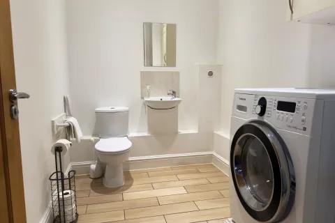 Utility room with additional toilet